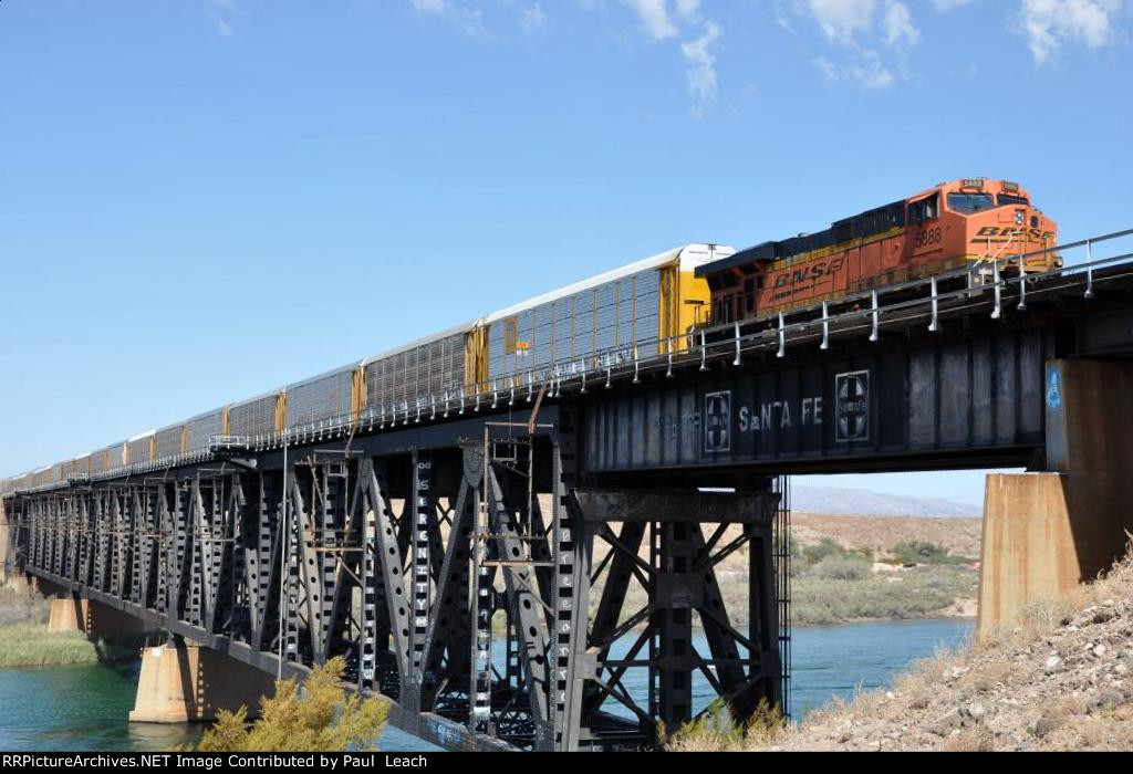 Vehicle train crosses over the bridge